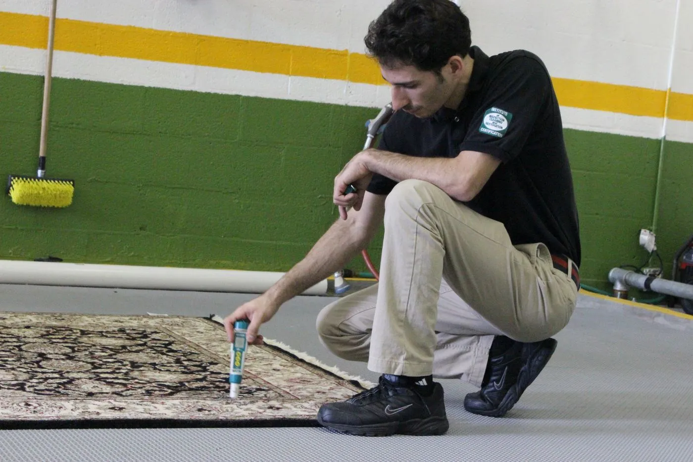 A hand-knotted rug laid flat on the wash floor and inspected before washing