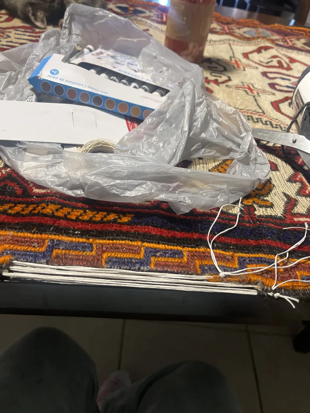 Warp threads laid in place during a hand rug repair at the bench